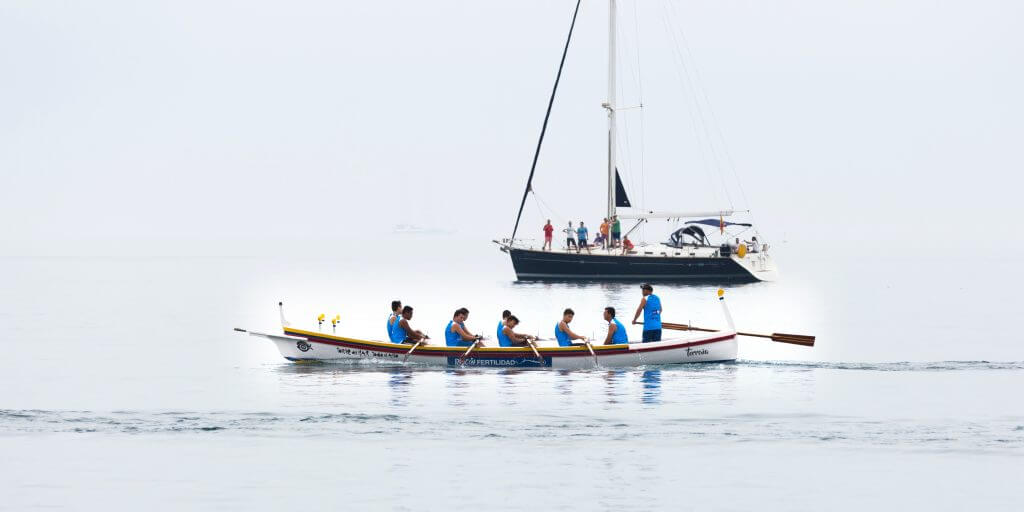 Picture of team in boat representing how important teamwork is when planning an event