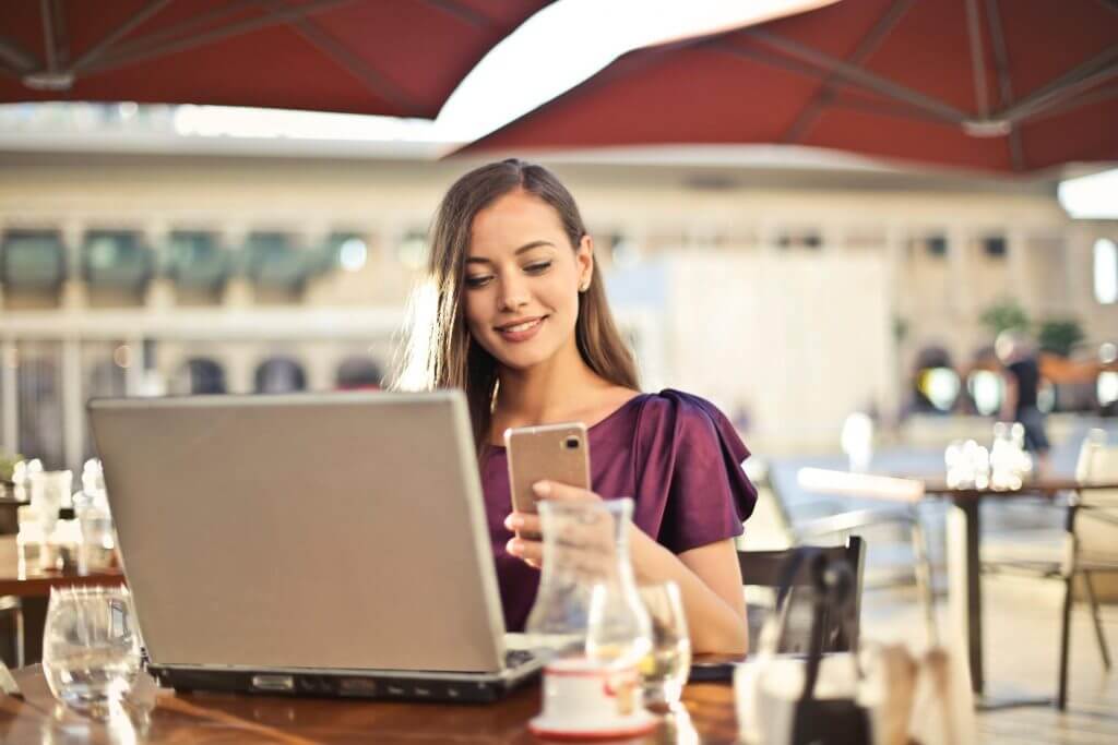 A woman speaking to her colleagues using a task management solution