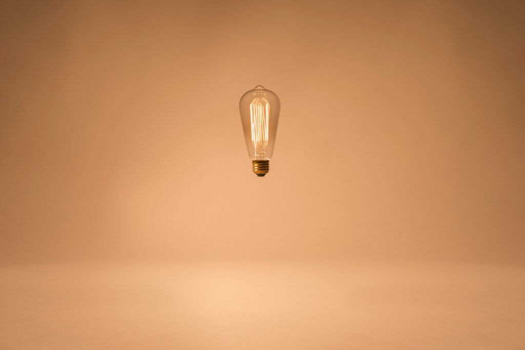 lightbulb floating signifying project scope statement objective