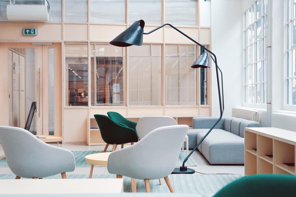 Open area with couches, tables and chairs.